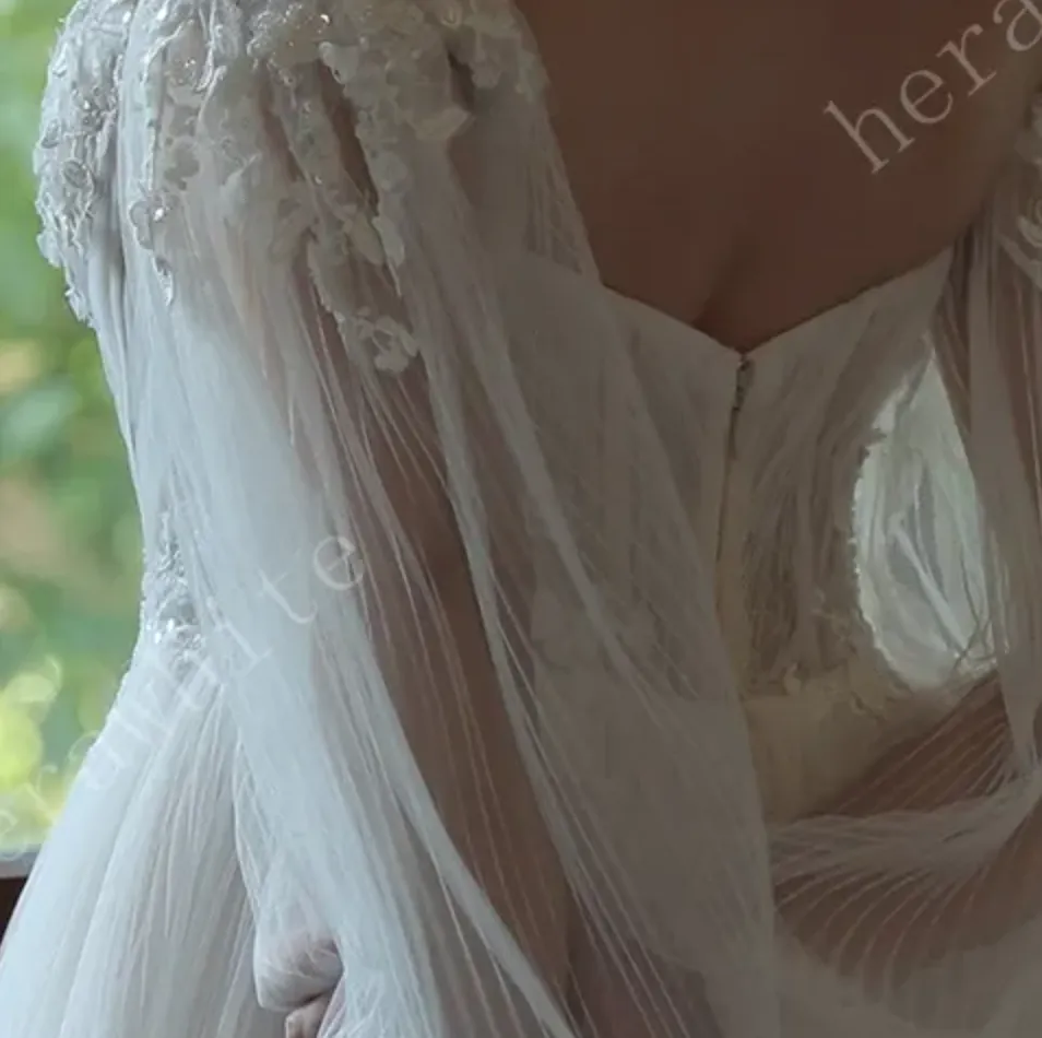 Enchanting Pleated Tulle A-line Wedding Dress with Pouf Sleeves