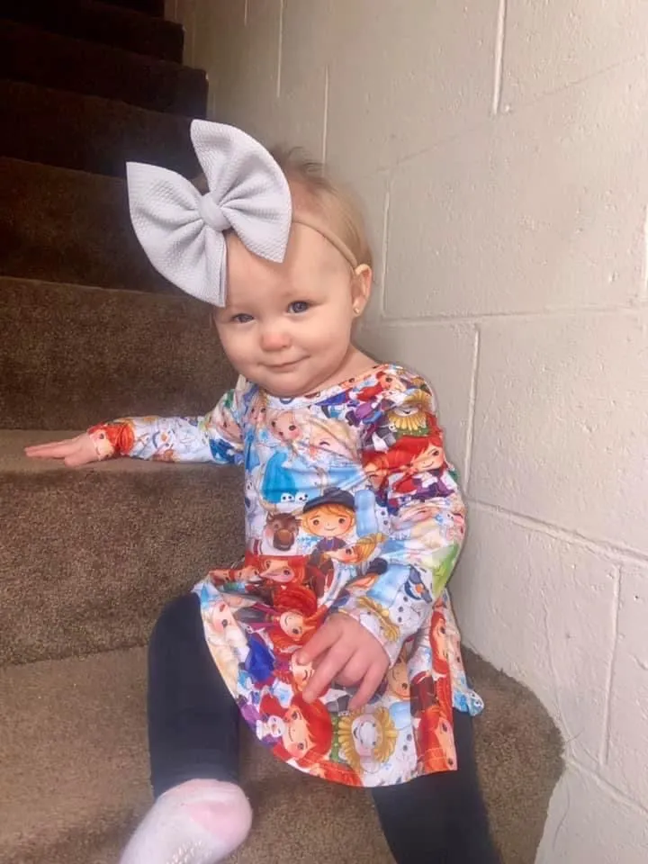 Frozen Long Sleeve Scoop Back Peplum Tunic